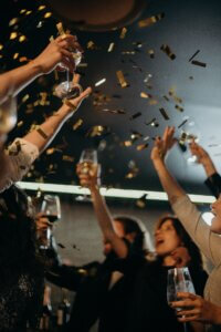people tossing confetti up in celebration
