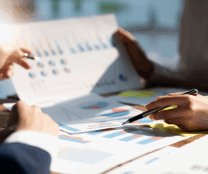 Financial professional reviewing investment charts and graphs to guide client financial planning