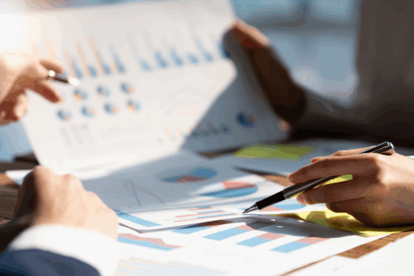 Financial professional reviewing investment charts and graphs to guide client financial planning